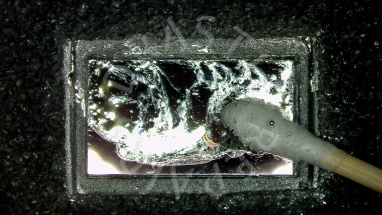 Die is cleaned and liquid metal is reapplied.